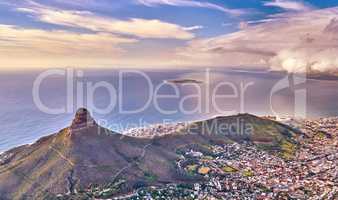 Aerial landscape view of the beautiful city of Cape Town during the day in summer with copyspace. Top of a scenic view of the mountains, town, and sea in a popular tourist destination for vacation
