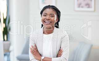 her joy shines from within. a young businesswoman taking a break in her office.
