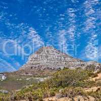 Copyspace with scenery of Lions Head at Table Mountain National Park in Cape Town, South Africa against a cloudy blue sky background. Panoramic of an iconic landmark and famous travel destination