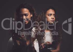 Its not a sign of weakness. Studio shot of a young woman experiencing mental anguish and screaming against a black background.