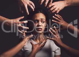 To close your eyes will not ease anothers pain. hands grabbing a young womans against a dark background.