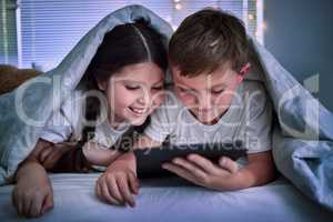 Sneaking in another episode. two little siblings using a digital tablet together at home.
