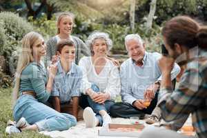 On the count of three. a multi-generational family spending time together outdoors.