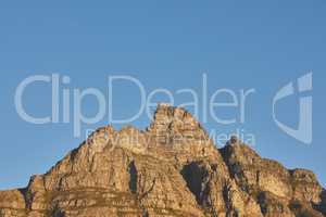 Copyspace with scenic landscape of a mountain peak against a clear blue sky on a sunny day. Scenic view of Table Mountain in Cape Town, South Africa in summer. Wide angle view of a nature background