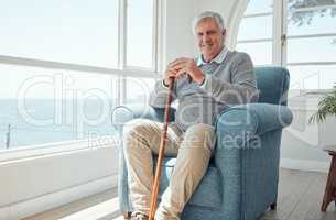 All I want in my golden years is to be safe. an elderly man enjoying the view from his window.