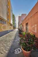 City view of residential houses or buildings in quiet alleyway street in Santa Cruz, La Palma, Spain. Historical spanish and colonial architecture in a tropical village and famous tourism destination