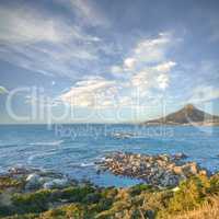 Landscape Lions Head and surroundings against a blue sky during the day in summer. Beautiful ocean and mountain scenery for relaxation. Small town by the beach for tourism and getaway vacations