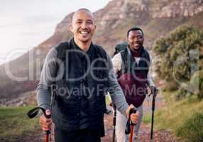 Happy hikers. Cropped portrait of two handsome young men hiking in the mountains.