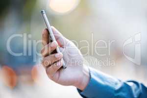 Reception anywhere, anytime. a businessman using a smartphone to send a text message.