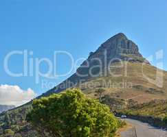 Copy space with scenic landscape view of Lions Head mountain in Cape Town, South Africa against a blue sky background. Magnificent panoramic of an iconic landmark to travel, explore and pass by road