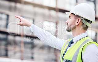 Make sure thats stable. a mature male architect doing checks at a building site.