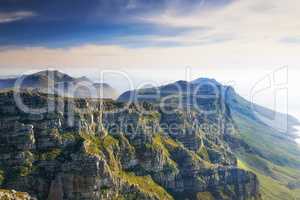 Landscape view, blue sky with copy space of Table Mountain in Western Cape, South Africa. Steep scenic famous hiking and trekking terrain with lush green mountainside. Travel and tourism to landmark