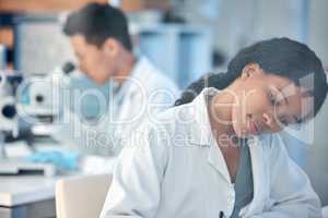 making the most of every moment. Shot of two coworkers peacefully working together in a lab.