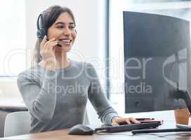 Hard work is an essential element. a young businesswoman working on a computer in an office.