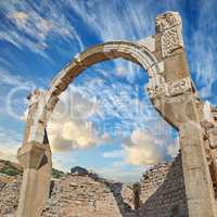 Old dilapidated city of Ephesus, Turkey under cloudy sky. Sightseeing and overseas travel for holiday, vacation and tourism. Excavated remains of historical structure from ancient history and culture
