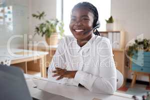 Ready to lead the charge. a young businesswoman using a headset and laptop in a modern office.