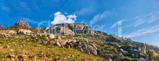 Copy space with scenery of Lions Head at Table Mountain National Park in Cape Town, South Africa against a cloudy blue sky background. Panoramic of an iconic landmark and famous travel destination