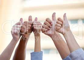 Your fullest potential is within reach. a group of business people giving the thumbs up.