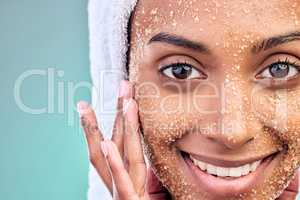 Say good morning to your skin with this enchanting treat. a young woman washing her face with a product against a blue background.