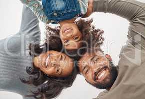 The love of a family is a lifes greatest blessing.. Shot of a couple huddling and holding each other at home.