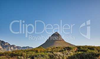 Landscape view of Lions Head in Cape Town, South Africa during a day. Beautiful mountains against a blue sky with copyspace. Travelling and exploring mother nature through hiking adventures in summer