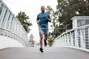 Do you dare be ordinary. Portrait of a sporty young man running outdoors.