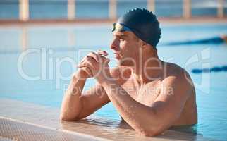 Looking for ways to improve. a handsome young male athlete swimming in an olympic-sized pool.