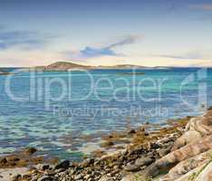 Landscape of empty rocky sea or river shore on summer day outside. Calm serene horizon, vibrant peaceful nature ocean and sea in Bodo, Nordland in Norway with copyspace. Travel abroad and overseas