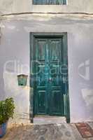 Vintage of wooden door on historical street in tropical village or city of Santa Cruz, La Palma, Spain. Texture detail of vibrant blue entrance way leading to comfortable home in tourism destination