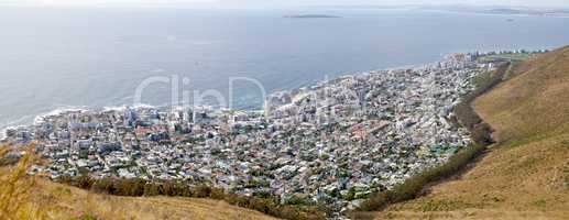 Aerial and panoramic view of Cape Town, Western Cape in South Africa. Landscape view of an urban city surrounded by the sea and ocean for holidays and vacations during summer for tourists from above