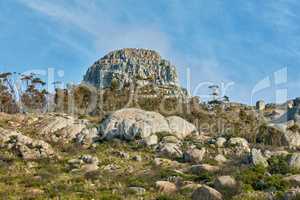 Copyspace and scenic landscape of Lions Head mountain in Cape Town, South Africa during summer holiday and vacation. View of mountain and boulders on remote hiking area against a clear blue sky