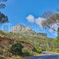 Copyspace with a mountain pass along Lions Head in Cape Town, South Africa against a blue sky background. Breathtaking panoramic of an iconic landmark and travel destination to explore on a road trip