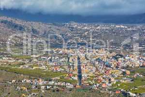 Landscape aerial view of Los Llanos, La Palma in the Canary Islands during the day. Scenic view of a city in an idyllic tourist travel destination from above. A small and beautiful seaside village