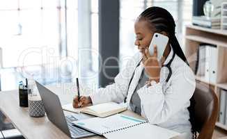 Be aware of the space you inhabit. a young doctor making a phone call while planning.