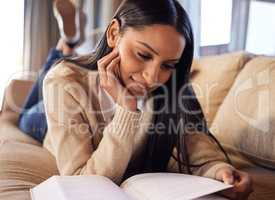 Be selfish with your time and use it for good. a beautiful young woman studying at home.