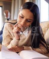 I study hard so exams can be easier. a beautiful young woman studying at home.