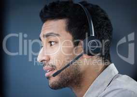 There is a potential issue with your account. a handsome young customer service agent sitting alone in the office and wearing a headset.