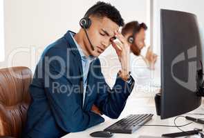 Can I just go home already. a young call centre agent looking stressed out while working in an office.