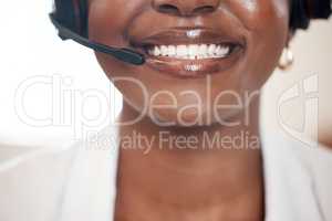 If youre happy, Im happy. Closeup shot of an unrecognisable call centre agent working in an office.