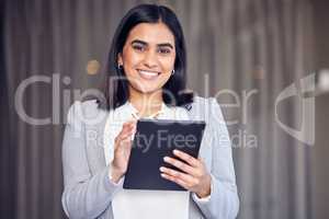 Meetings and schedules. a beautiful young. businesswoman using a digital tablet while standing outside.