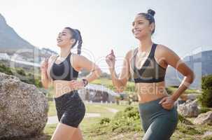 A great friendship that goes the distance. two fit young women going for a run in a park.