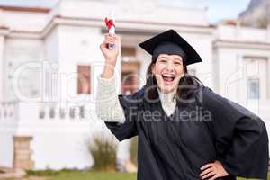 Yes Im going to brag all day. Portrait of a young woman cheering on graduation day.