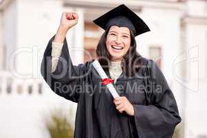 Im so damn proud of myself. Portrait of a young woman cheering on graduation day.