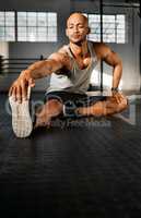 Stiff muscles are easily avoided. a young man stretching his legs before a workout.