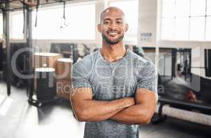 Fitness only becomes more important as you age. a handsome young man taking a break during his workout.