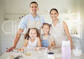 This is our quality time. a young family baking together at home.