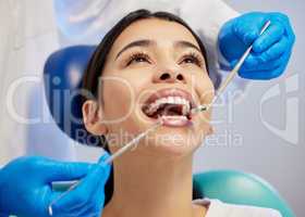 Live on the brighter side of life with a beautiful smile. a young woman having a dental procedure performed on her.