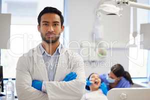 Nobody does dentistry like I do. Portrait of confident a young dentist working in his consulting room.