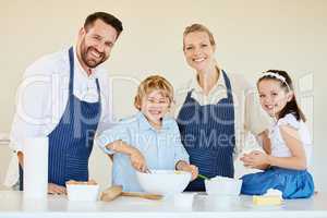 Bonding over baking. a young family cooking together at home.