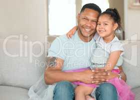 Shes my little princess. an adorable little girl bonding with her father in the living room at home.
